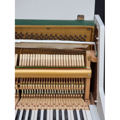 1098 - A small Kemble upright piano, 113.5cm wide; together with a matching stool. (2)