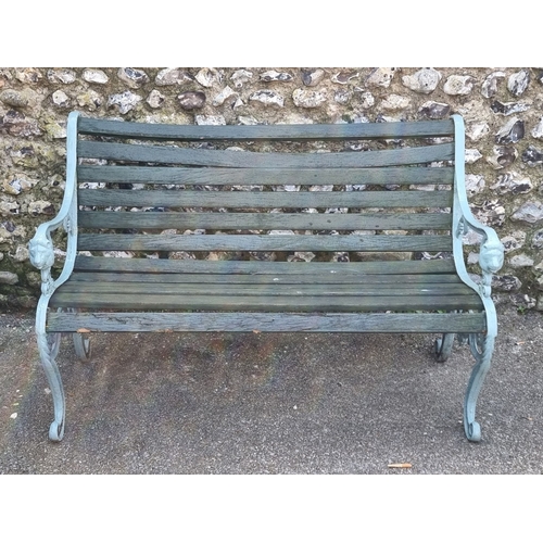 1115 - A green painted aluminium garden bench, 124.5cm wide; together with a large green stained folding ga... 