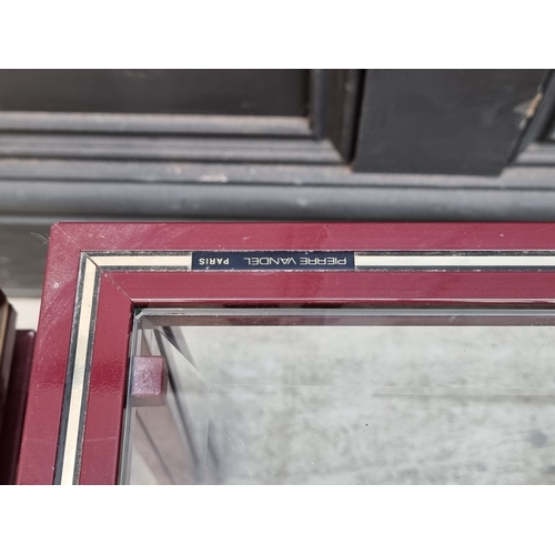 1118 - A nest of three Pierre Vandel occasional tables, each with bevelled glass inset, (smallest chipped),... 