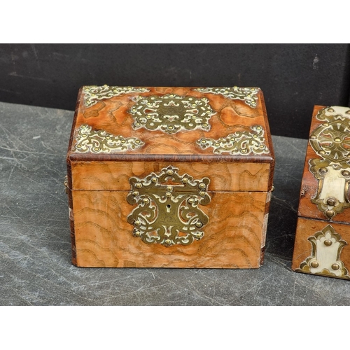 1125 - Three Victorian walnut and brass strapwork caskets, the largest with ivory mounts, 23.5cm wide. (3) ... 