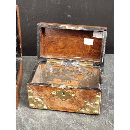 1125 - Three Victorian walnut and brass strapwork caskets, the largest with ivory mounts, 23.5cm wide. (3) ... 