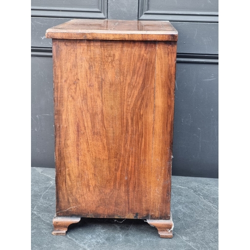 1134 - Miniature Furniture: an 18th century style walnut and feather banded chest of drawers, 50cm high x 4... 