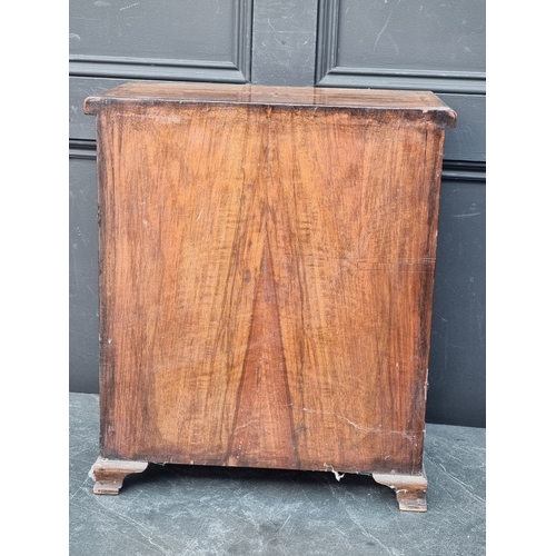1134 - Miniature Furniture: an 18th century style walnut and feather banded chest of drawers, 50cm high x 4... 