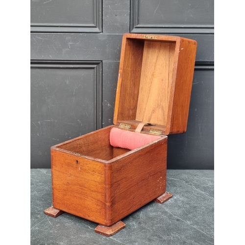 1147 - A small teak cellarette, 32.5cm high x 25cm wide x 34cm deep.