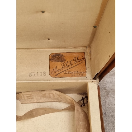 1151 - A Victorian oak decanter box, enclosing four lipped clear glass decanters and stoppers, (one decante... 