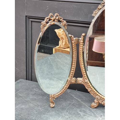 1157 - A vintage gilt gesso triptych dressing table mirror, 57.5cm high x 75.5cm wide.