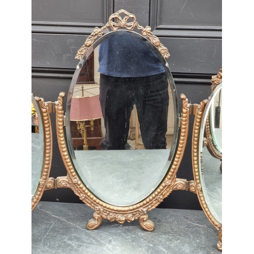 1157 - A vintage gilt gesso triptych dressing table mirror, 57.5cm high x 75.5cm wide.