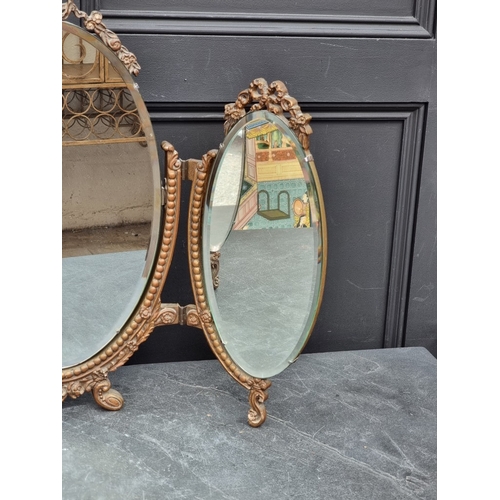 1157 - A vintage gilt gesso triptych dressing table mirror, 57.5cm high x 75.5cm wide.