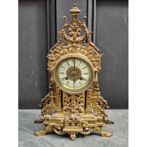 1180 - An early 20th century brass mantel clock, with ivorine dial, 37cm high, with pendulum.... 