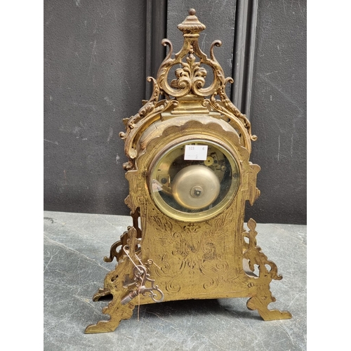 1180 - An early 20th century brass mantel clock, with ivorine dial, 37cm high, with pendulum.... 