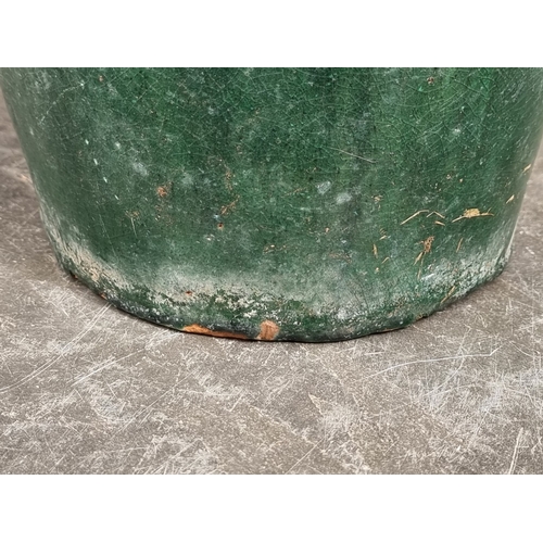 1256 - A large green glazed terracotta vase, 60cm high, (drilled to base).