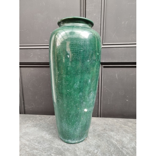 1256 - A large green glazed terracotta vase, 60cm high, (drilled to base).