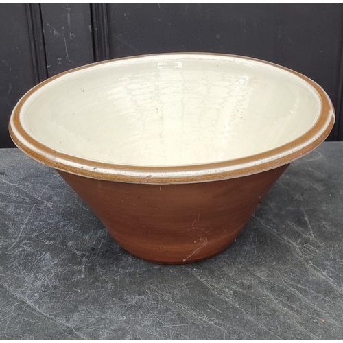 1303 - A large glazed terracotta dairy bowl, 23cm high x 48cm diameter.