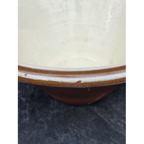 1303 - A large glazed terracotta dairy bowl, 23cm high x 48cm diameter.