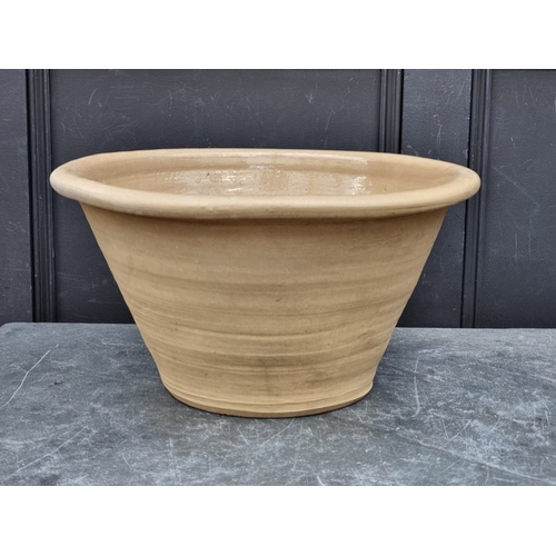 1304 - A graduated pair of dairy bowls, largest 26cm high x 50cm diameter. (2)
