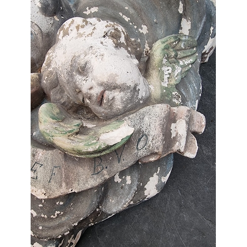 1308 - A large painted plaster cherub wall bracket, 44 x 48.5cm, (s.d.).