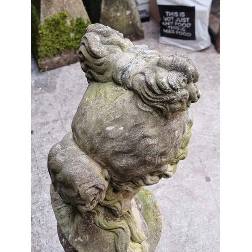 1311 - A life-sized composition stone female bust, on associated pedestal, 102.5cm high.