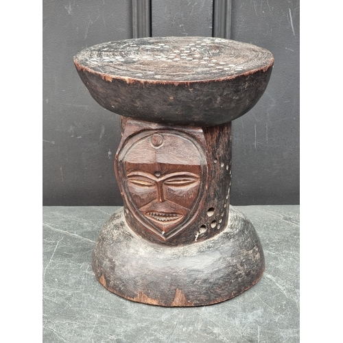 1326 - Ethnographica: a Central African carved wood mask stool, 29.5cm high.
