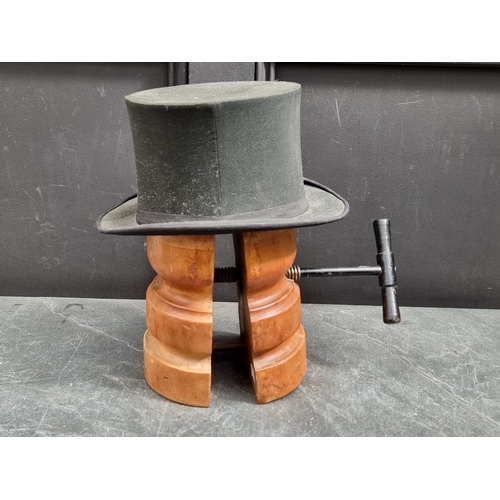 1327 - A vintage beech hat stretcher, 30cm high; together with an opera hat. (2)