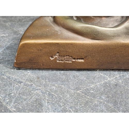 1332 - An Art Deco style durastone figure, by Austin, 49cm high.