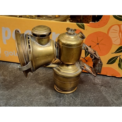 1352 - A collection of copper and brass, to include a set of kitchen scales, and a Lucas Aceta cycle lamp.... 