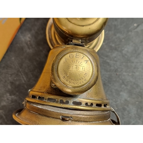 1352 - A collection of copper and brass, to include a set of kitchen scales, and a Lucas Aceta cycle lamp.... 