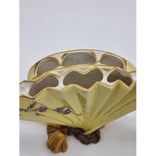 1358 - A very unusual pair of Victorian Royal Worcester fan vases, circa 1880, each painted with wildflower... 