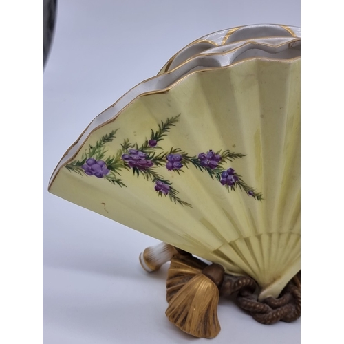 1358 - A very unusual pair of Victorian Royal Worcester fan vases, circa 1880, each painted with wildflower... 
