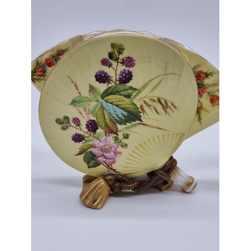 1358 - A very unusual pair of Victorian Royal Worcester fan vases, circa 1880, each painted with wildflower... 