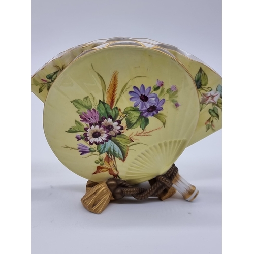 1358 - A very unusual pair of Victorian Royal Worcester fan vases, circa 1880, each painted with wildflower... 
