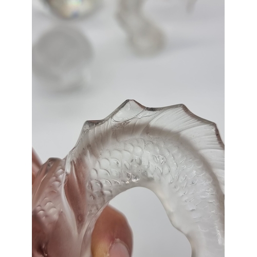 1359 - A Lalique frosted glass owl, 8.5cm high; together with three Lalique koi fish, (chips to all three);... 