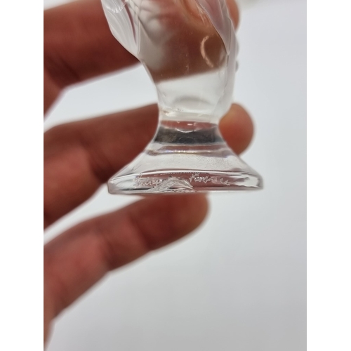 1359 - A Lalique frosted glass owl, 8.5cm high; together with three Lalique koi fish, (chips to all three);... 