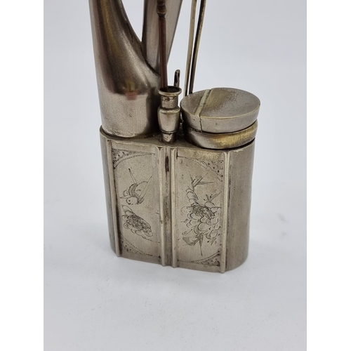 1363 - A Chinese nickel plated opium pipe, 25.5cm high.