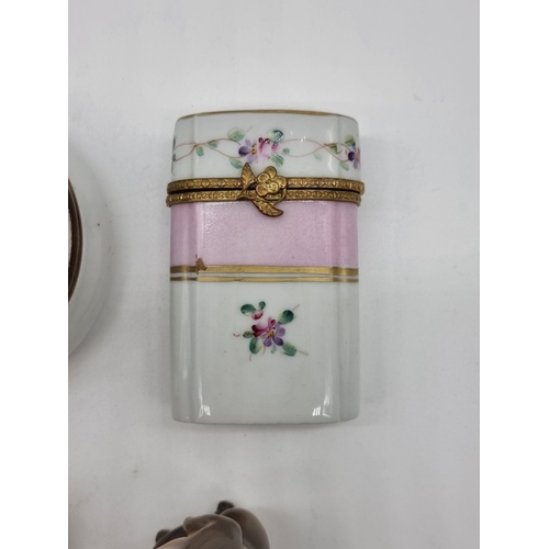 1367 - A Georgian enamel circular box, 4.2cm diameter; together with two further enamel boxes; a small Roya... 