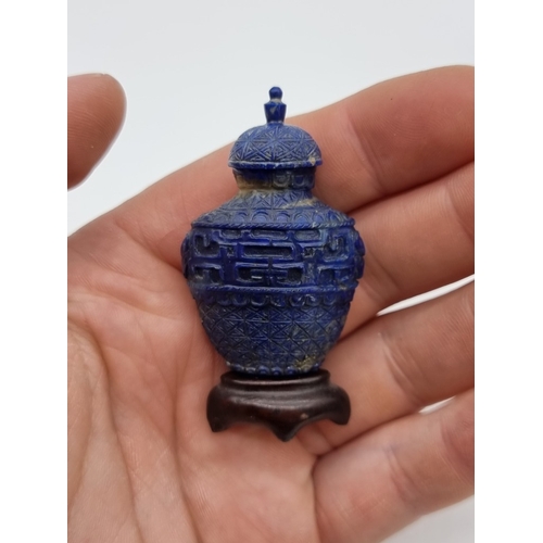 1368 - A pair of Chinese carved lapis lazuli snuff bottles, one with cover, total height 5.2cm, with one ha... 