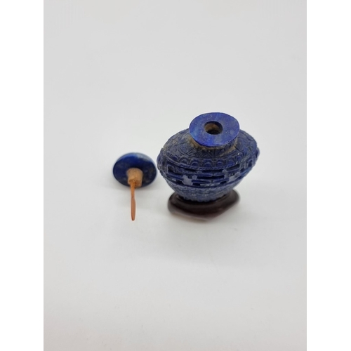 1368 - A pair of Chinese carved lapis lazuli snuff bottles, one with cover, total height 5.2cm, with one ha... 
