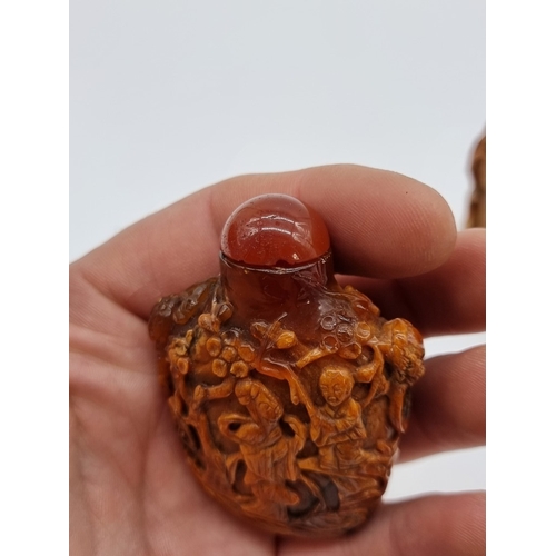 1369 - Two Chinese carved amber snuff bottles and hardstone covers, probably Qing, total height of largest ... 