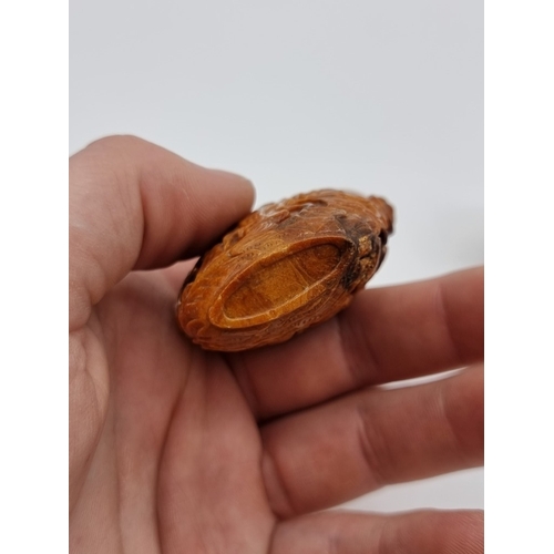 1369 - Two Chinese carved amber snuff bottles and hardstone covers, probably Qing, total height of largest ... 