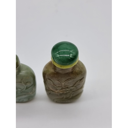 1372 - Two Chinese carved jade snuff bottles and stoppers, Qing, total height of largest 7cm. (2)... 