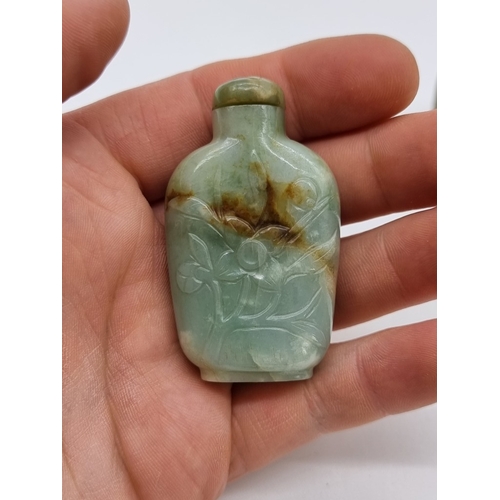 1372 - Two Chinese carved jade snuff bottles and stoppers, Qing, total height of largest 7cm. (2)... 