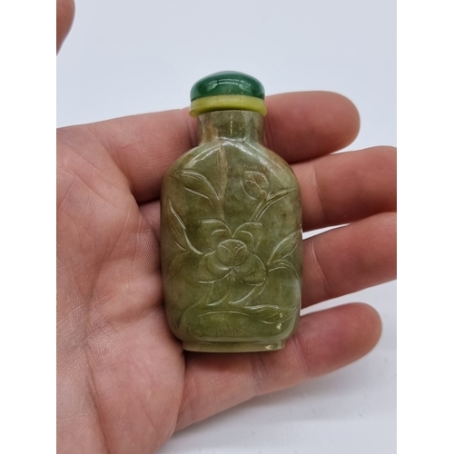 1372 - Two Chinese carved jade snuff bottles and stoppers, Qing, total height of largest 7cm. (2)... 