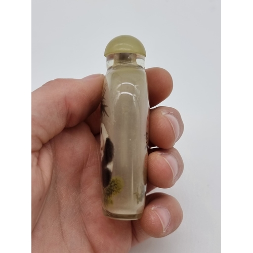 1373 - A Chinese internally painted glass 'cat and panda' snuff bottle, signed, with jade cover, total heig... 