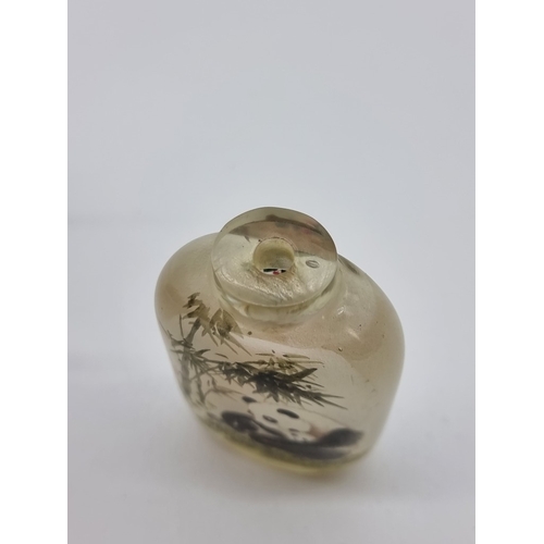 1373 - A Chinese internally painted glass 'cat and panda' snuff bottle, signed, with jade cover, total heig... 