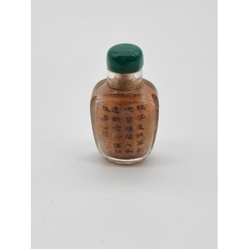 1374 - A Chinese internally painted rock crystal snuff bottle, 19th century, of panelled form, painted with... 