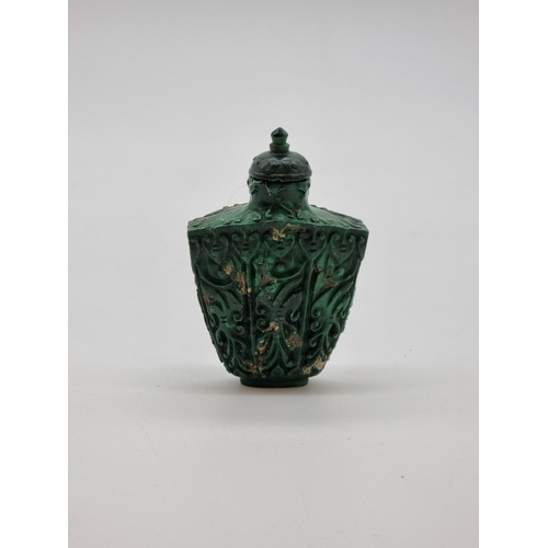1375 - A Chinese carved malachite snuff bottle and stopper, total height 7.4cm.