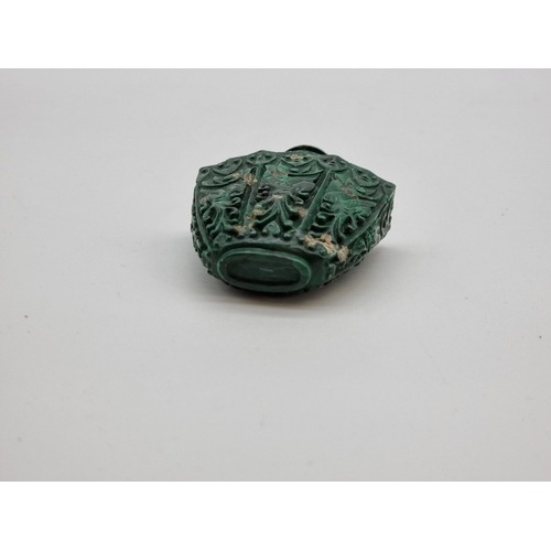 1375 - A Chinese carved malachite snuff bottle and stopper, total height 7.4cm.