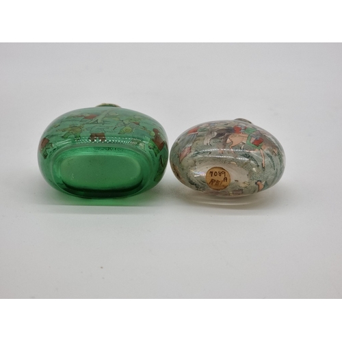 1376 - Two Chinese internally painted glass snuff bottles and hardstone stoppers, probably 19th century, ea... 