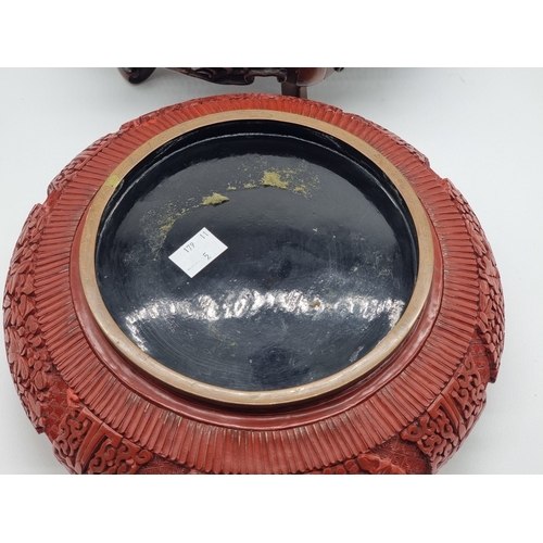 1392 - An unusual Chinese cinnabar lacquer and cloisonne enamel bowl, 24.5cm diameter, on good carved and p... 