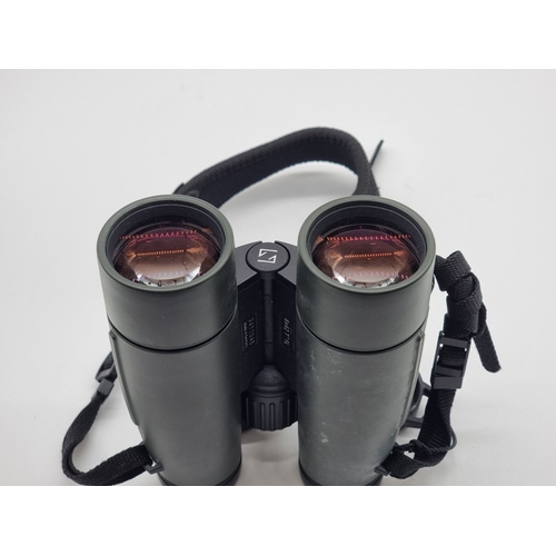 1396 - A pair of Zeiss Victory FL 8x42 binoculars, with lens caps and soft bag.