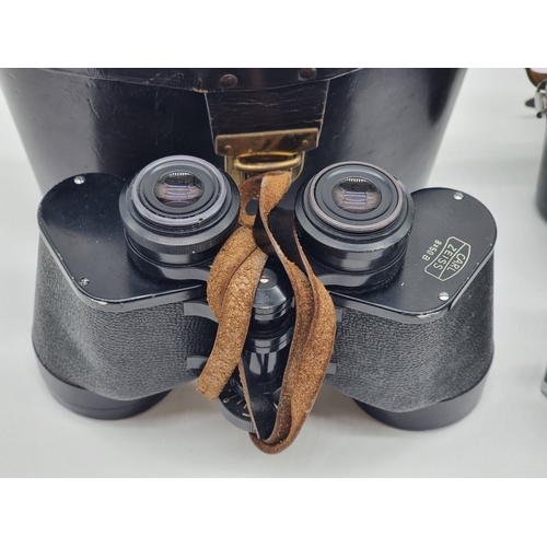 1397 - A pair of Carl Zeiss 8x50 B binoculars, in brown leather case; together with a Contaflex S camera, w... 